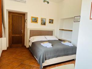 Letto o letti in una camera di Casa Mercurio
