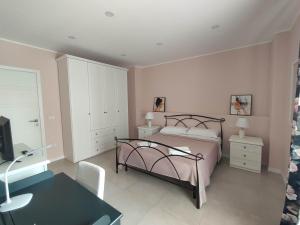 Postel nebo postele na pokoji v ubytování GArt Riviera B&B