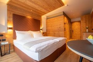 Postel nebo postele na pokoji v ubytování Hotel Alpi