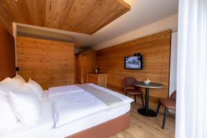 Postel nebo postele na pokoji v ubytování Hotel Alpi