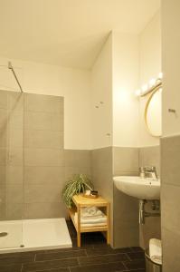 a bathroom with a sink and a bath tub and a sink at Relais Quattro Fontane in Rome