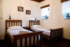Katil atau katil-katil dalam bilik di Anhel Hotel