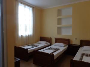 Postel nebo postele na pokoji v ubytování White Guest House