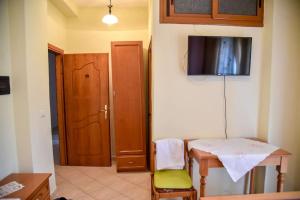 TV a/nebo společenská místnost v ubytování Hotel Geraldo