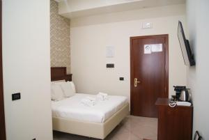 Postel nebo postele na pokoji v ubytování Monti 66 Hotel