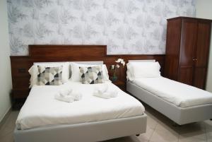 Postel nebo postele na pokoji v ubytování Monti 66 Hotel