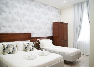 Postel nebo postele na pokoji v ubytování Monti 66 Hotel