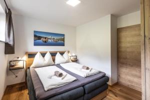 Postel nebo postele na pokoji v ubytování Dachstein Chalet