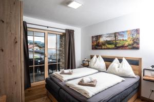 Postel nebo postele na pokoji v ubytování Dachstein Chalet