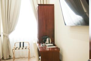 TV a/nebo společenská místnost v ubytování Monti 66 Hotel