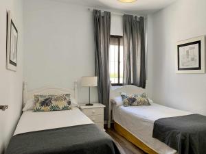 Posteľ alebo postele v izbe v ubytovaní Urb Las Cañas Apartamento F1 + 20 fotografií