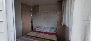 Postel nebo postele na pokoji v ubytování Mobil Home sur la côte landaise