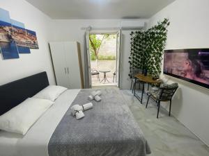 a bedroom with a bed with two teddy bears on it at King's Landing Esma' house in Dubrovnik