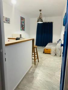 a room with a desk and a bed in a room at Limni No 2 self catering apartment in Posidhonía