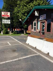 a parking lot in front of a coffee motel at Copper River Motel in Terrace