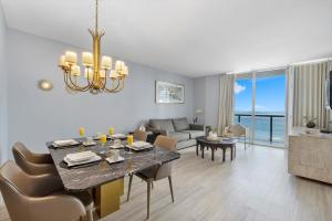 a dining room and living room with a dining table at Special Offer at Icon Brickell with Ocean view in Miami