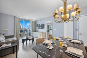 a dining room and living room with a dining table at Special Offer at Icon Brickell with Ocean view in Miami