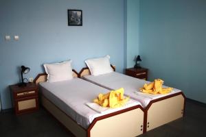 Ένα ή περισσότερα κρεβάτια σε δωμάτιο στο Zoya Guest House