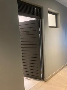 a garage door with a window in a room at Zimbali Lakes Boulevard Suites Studio Apartments in Ballito