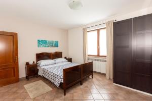 a bedroom with a bed and a window at Dory's apartment in Arquata Scrivia