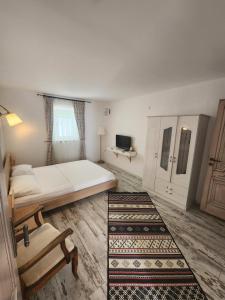 A bed or beds in a room at Tarcin Alacati Hotel