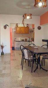 a dining room with a table and chairs at Lo de la Nercida in Tornquist