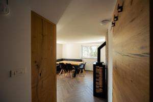 a kitchen and dining room with a table and chairs at Holiday House Chilly in Kotlje