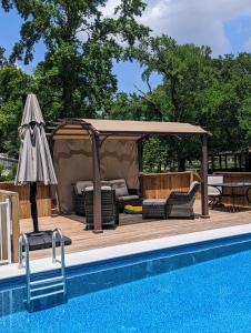 a gazebo next to a swimming pool next to at Cozy Barn with Pool Access & Near Lake Conroe in Montgomery