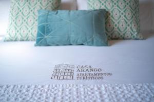 Posteľ alebo postele v izbe v ubytovaní Apartamentos Turísticos Casa Arango