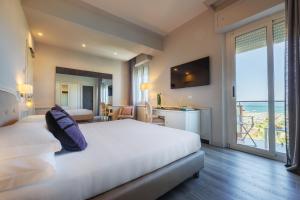 Lova arba lovos apgyvendinimo įstaigoje Parco dei Principi Boutique Hotel