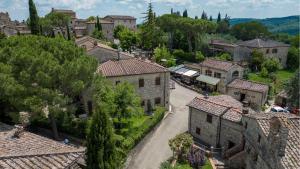 an aerial view of a village with houses and trees at Casa Isabella in Gaiole in Chianti
