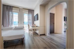 Televizorius ir (arba) pramogų centras apgyvendinimo įstaigoje Parco dei Principi Boutique Hotel