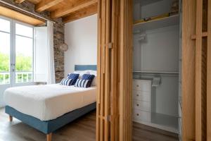 Posteľ alebo postele v izbe v ubytovaní Apartamentos Turísticos Casa Arango