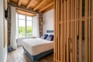 Posteľ alebo postele v izbe v ubytovaní Apartamentos Turísticos Casa Arango