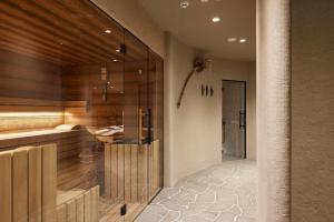 a bathroom with a shower and a glass wall at Vila Pavlina in Kranjska Gora