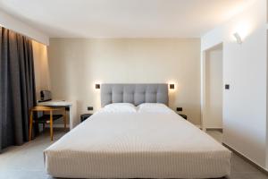 Llit o llits en una habitació de Lofos Village