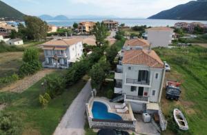 an aerial view of a house with a swimming pool at Santa Emelia in Vasiliki