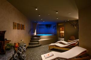 a living room with a tub in the middle of the room at Vila Pavlina in Kranjska Gora