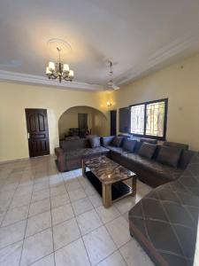 a living room with a couch and a table at Villa Saran in Bamako