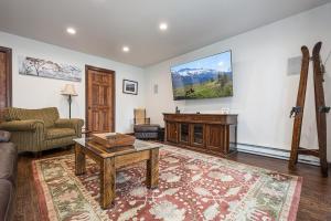 a living room with a couch and a table at Bear Trap in Swanton