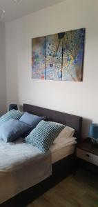 Giường trong phòng chung tại Apartament Latarnia Morska