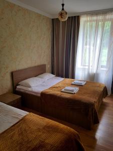 Кровать или кровати в номере Guest House on V. Pshavela 50