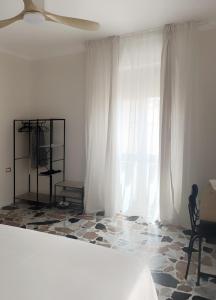 Postel nebo postele na pokoji v ubytování Leonardo Da Vinci Rooms + 8 fotografií
