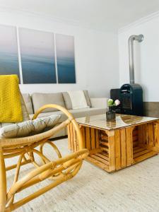 a living room with a coffee table and a couch at Landhaus mit Garten in Neutal +28 photos
