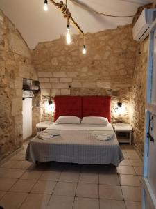Tempat tidur dalam kamar di La carraia