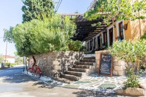 a red bike parked in front of a building at Vagia Traditional, Aegina Island in Vaia