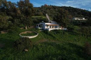 an aerial view of a house on a hill at Annas Katikia in Drymonas