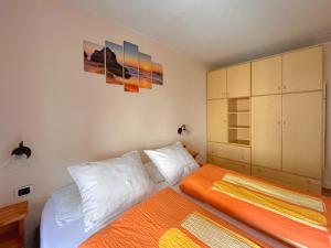 A bed or beds in a room at Skyrim Apartment - City Centre