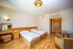 Postel nebo postele na pokoji v ubytování Nefelejcs Hotel