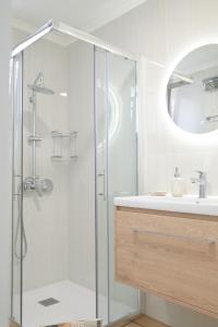 a bathroom with a shower and a sink at Villa Michalis in Liapades